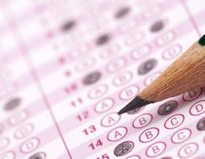 A standardized test paper with a pencil in closeup. 