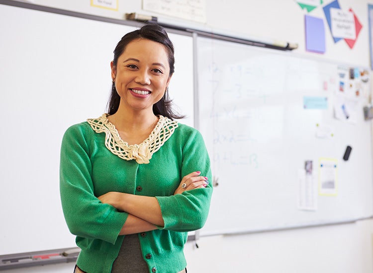 teacher in front of whiteboard