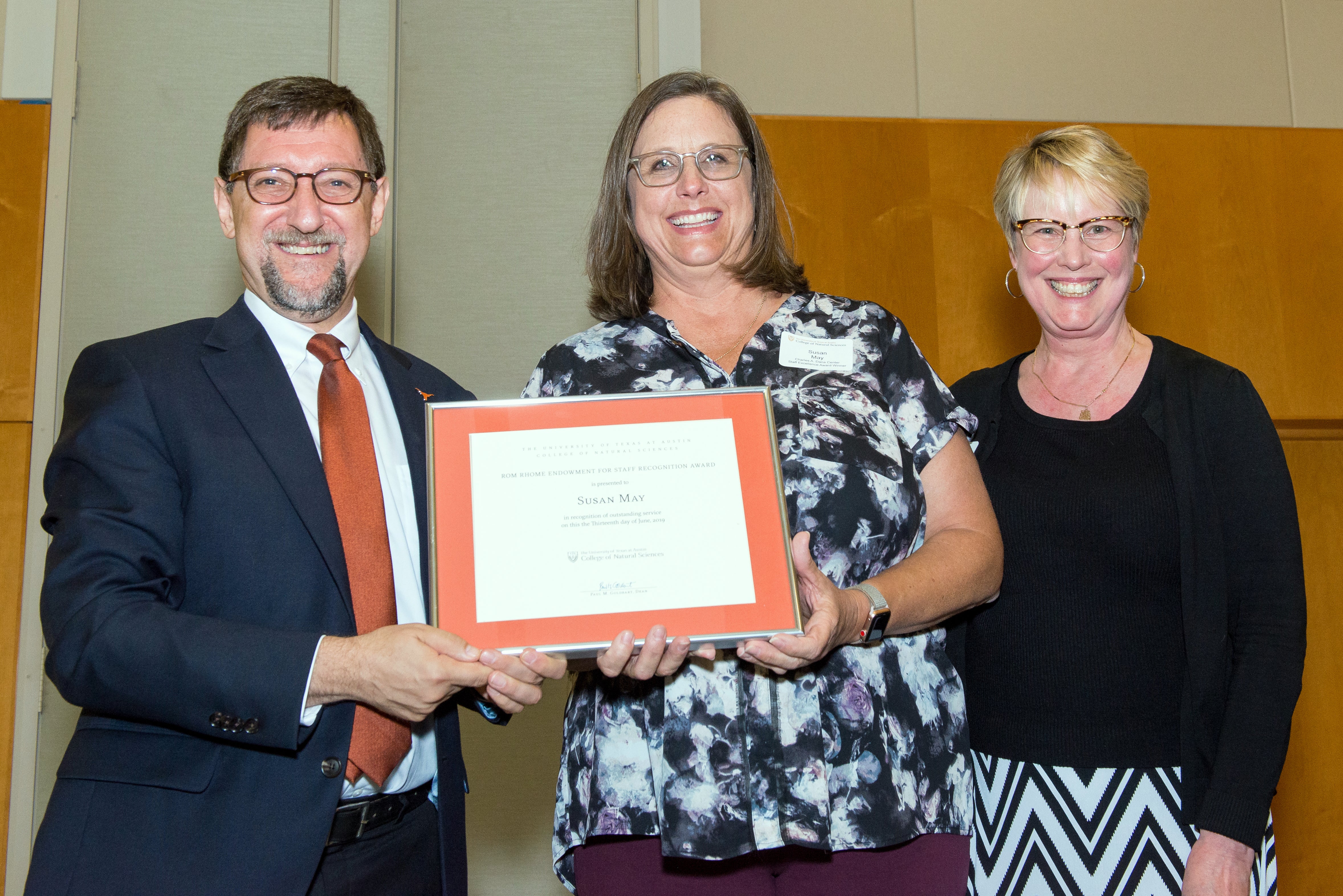 picture of dana center staff member susan may accepting award