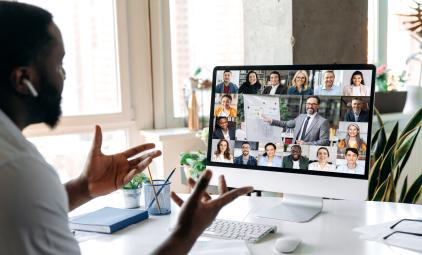 person participating in web conference meeting