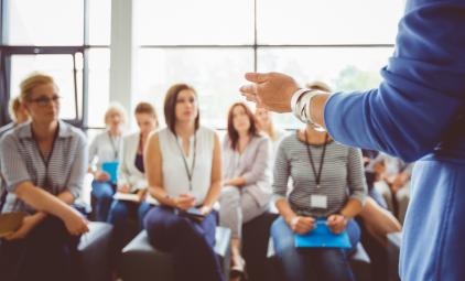 facilitator standing in front of people