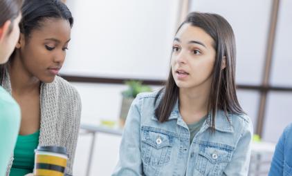 three students discussing a problem