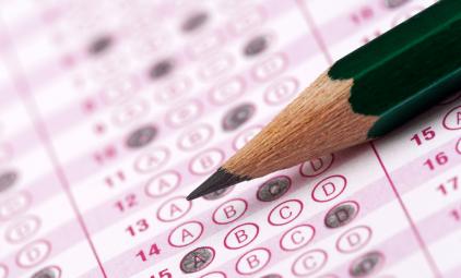 A standardized test paper with a pencil in closeup.