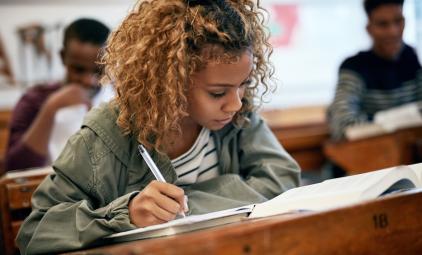 student taking notes