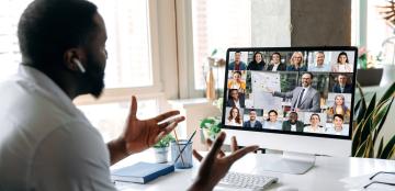 person participating in web conference meeting