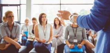 facilitator standing in front of people