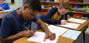 two students working at their desks