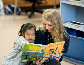 Reading tutor working with student.