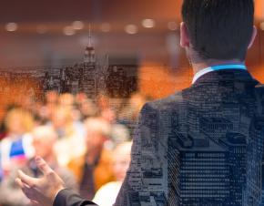 man speaking at conference