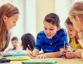 Group of students working together at a table.