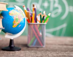 desk with books, globe, and pencils