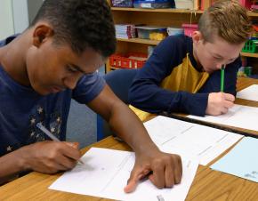 two students working at their desks