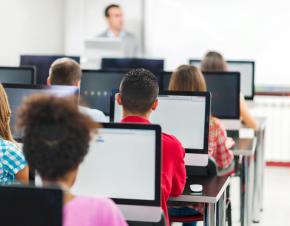 students with computers in a classroom