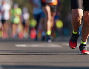 photo of a person's legs running a marathon