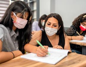 teacher helping a student