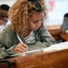 student taking notes